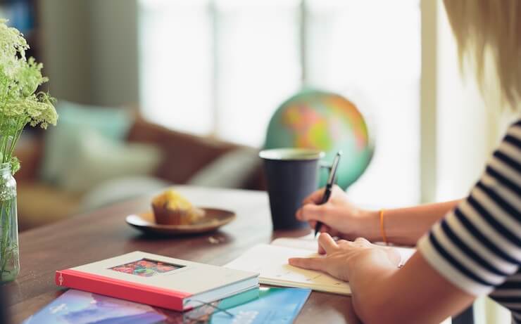 Woman spending time journaling and investing in herself