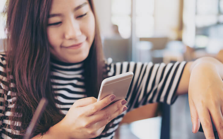 Woman looking at budgeting tools on her phone